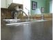 Close up on stainless steel kitchen sink with chrome faucet, complimented by neutral tiled backsplash at 8431 Sw 93Rd Pl # F, Ocala, FL 34481