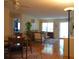 Inviting living room with dining area, showcasing wood floors and comfortable seating at 8431 Sw 93Rd Pl # F, Ocala, FL 34481