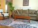 Comfortable living room with a plush sofa, accent chair, and patterned rug at 8431 Sw 93Rd Pl # F, Ocala, FL 34481