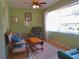 Inviting living room with bright windows, a ceiling fan, a love seat, and a comfortable recliner at 8431 Sw 93Rd Pl # F, Ocala, FL 34481