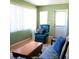 Living room with a recliner, loveseat, and a window at 8431 Sw 93Rd Place # F, Ocala, FL 34481
