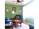 Inviting living room with green walls, comfortable seating, a ceiling fan and natural light at 8431 Sw 93Rd Place # F, Ocala, FL 34481