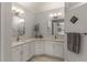 Elegant bathroom with double vanity, modern fixtures, and tasteful decor for a spa-like experience at 8492 Hartford Way, Mount Dora, FL 32757