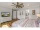 Inviting bedroom showcasing an adjacent bathroom, light paint, and modern fixtures for comfortable living at 8492 Hartford Way, Mount Dora, FL 32757