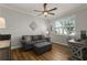 Cozy bedroom featuring a comfortable couch and natural light at 8492 Hartford Way, Mount Dora, FL 32757