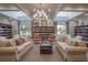 Cozy library with comfortable seating, bookshelves, a decorative chandelier, and ample natural light at 8492 Hartford Way, Mount Dora, FL 32757