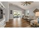 Spacious living room with ample seating, natural light, and stylish decor at 8492 Hartford Way, Mount Dora, FL 32757