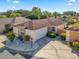Aerial view of the home with well-maintained landscaping and a two-car garage at 919 Medira Dr, The Villages, FL 32159