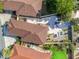 High-angle shot of the property showing layout, landscaping, and patio area at 919 Medira Dr, The Villages, FL 32159