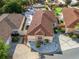 Overhead view of the property featuring the home, landscaping, and surrounding neighborhood at 919 Medira Dr, The Villages, FL 32159