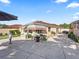 Backyard view showcasing patio with awning, outdoor seating, and landscaping at 919 Medira Dr, The Villages, FL 32159