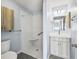 Bathroom features a walk-in shower, modern vanity and gray toned walls at 919 Medira Dr, The Villages, FL 32159