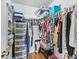 Walk in closet features hardwood floors, shelving and ample storage space at 919 Medira Dr, The Villages, FL 32159