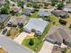Aerial view of the home and neighborhood showcasing the well-maintained landscaping and community at 951 Chapman Loop, The Villages, FL 32162