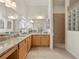 Large bathroom with granite countertops, double sinks, vanity, and walk-in shower at 951 Chapman Loop, The Villages, FL 32162