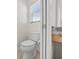 Powder room featuring a toilet, a small vanity, and a window at 951 Chapman Loop, The Villages, FL 32162