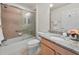 Bathroom featuring a shower with glass door, granite countertop, and tile flooring at 951 Chapman Loop, The Villages, FL 32162