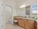 Bright bathroom vanity with granite countertops and ample storage space at 951 Chapman Loop, The Villages, FL 32162