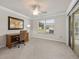 Bedroom with a view of backyard through a sliding glass door and large window at 951 Chapman Loop, The Villages, FL 32162