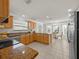 Bright kitchen featuring stainless steel appliances that opens to dining area at 951 Chapman Loop, The Villages, FL 32162