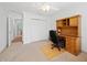 Bright office space featuring a built-in desk, ceiling fan, and natural light at 951 Chapman Loop, The Villages, FL 32162