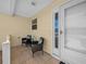 Inviting covered patio featuring outdoor seating and a view of the entryway at 951 Chapman Loop, The Villages, FL 32162