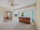 Bright sunroom with a large hot tub, ceiling fan, and backyard views at 951 Chapman Loop, The Villages, FL 32162