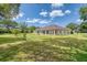 Lush backyard offering ample space, mature trees, and a serene environment for outdoor enjoyment and entertaining at 987 Princeton Dr, Clermont, FL 34711