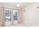 Inviting bedroom with neutral walls, large windows and contemporary ceiling fan at 987 Princeton Dr, Clermont, FL 34711