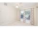 This light-filled bedroom has two large windows and neutral carpet at 987 Princeton Dr, Clermont, FL 34711