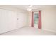 A traditional bedroom with carpet, two closets, one window and matching window treatments at 987 Princeton Dr, Clermont, FL 34711