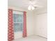 Cozy bedroom with bright windows framed by decorative curtains, enhancing natural light and style at 987 Princeton Dr, Clermont, FL 34711