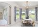 Cozy dining nook with bright windows and stylish pendant lighting at 987 Princeton Dr, Clermont, FL 34711