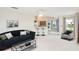 Bright living room boasts modern furnishings and an open layout with breakfast bar at 987 Princeton Dr, Clermont, FL 34711