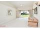 Bright living room features plush carpet, neutral walls, and a slider to a patio for seamless indoor-outdoor living at 987 Princeton Dr, Clermont, FL 34711