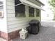 Side of the home with awning and a grill covered at 1014 Dustin Dr, Lady Lake, FL 32159