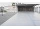 Home featuring a covered front entryway, stone facade, and a long paved driveway at 1014 Dustin Dr, Lady Lake, FL 32159