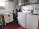 Functional laundry area equipped with a washer, dryer, storage and natural light from a window at 1014 Dustin Dr, Lady Lake, FL 32159