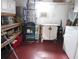 Storage area with washer and dryer, shelves, rolling cart and storage cabinets at 1014 Dustin Dr, Lady Lake, FL 32159