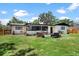 Backyard featuring an outdoor seating area with view of the rear screened porch at 1016 Cottonwood St, Leesburg, FL 34748