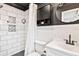 Modern bathroom featuring sleek fixtures, subway tile, and a walk-in shower at 1016 Cottonwood St, Leesburg, FL 34748