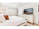 Inviting bedroom with a cozy bed, soft lighting, and ample closet space at 1016 Cottonwood St, Leesburg, FL 34748
