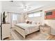 Bright bedroom with a comfortable bed, soft lighting, and tasteful decor at 1016 Cottonwood St, Leesburg, FL 34748