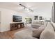 Comfortable living room with a large sectional sofa, TV, and an open floorplan at 1016 Cottonwood St, Leesburg, FL 34748