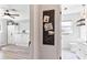 A view from the doorway into an office or bedroom space and an attached bathroom at 1016 Cottonwood St, Leesburg, FL 34748