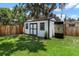Backyard shed with double doors and a target for outdoor activities at 1016 Cottonwood St, Leesburg, FL 34748