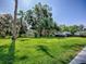 Large backyard with a beautiful tree and chicken coop at 111 Cardinal Ln, Eustis, FL 32726