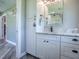 Bathroom with white vanity and mirror at 111 Cardinal Ln, Eustis, FL 32726