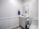 Bathroom with a toilet, vanity and mirror at 111 Cardinal Ln, Eustis, FL 32726