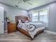 This clean bedroom features gray walls, modern decor, and great lighting for a relaxing atmosphere at 111 Cardinal Ln, Eustis, FL 32726